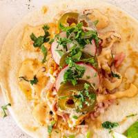 Fish Tacos · (3) Seared cod, pickled slaw, chipotle crema, pickled jalapeno, radish, cilantro served on a...
