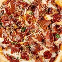 The Full Monty · House made pizza sauce, spicy Italian sausage, pepperoni, hot coppa, red chili flakes, mozza...