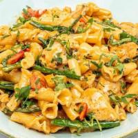 Chipotle Chicken Pasta · Southwest infused cream sauce, campanelle pasta, grilled chicken breast, broccolini, red and...