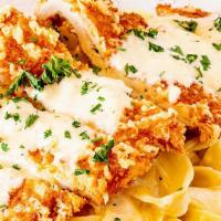 Chicken Schnitz · Parmesan breaded chicken schnitzel, pappardelle pasta, creamy alfredo sauce