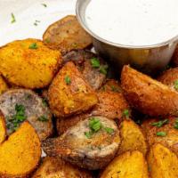 Large Crispy Marble Potatoes · Dusted with house cajon rub - served with green onion creme