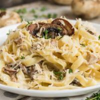 Fettuccine Chicken Mushrooms · Made in a white sauce with chicken and mushrooms.