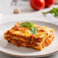 Lasagna Bolognese · Layers of fresh pasta, meat and mozzarella cheese.