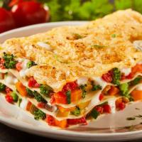 Veggie Lasagna · Spaghetti in a hearty meat sauce and meatballs.