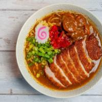 Katsu curry ramen · Deep fried pork cutlet , scallions, pickled daikon on top of curry ramen