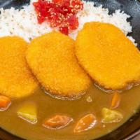 Vegetable Croquette Curry · Vegetable croquette, served with curry, rice, and pickles.