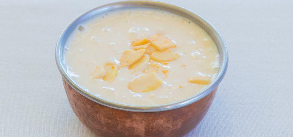 Kheer · Popular rice dessert flavored of cardamom & saffron, garnished with pistachios & almonds.