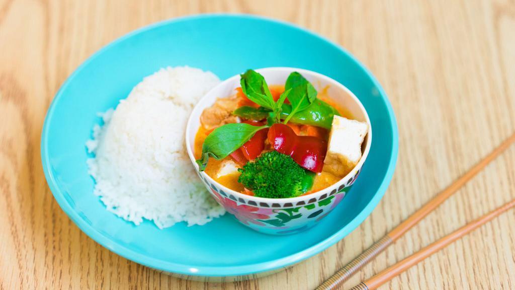 Red Curry Rice Plate · Red curry sauce with bell pepper, carrot, sting bean, basil serve with your choice of protein.