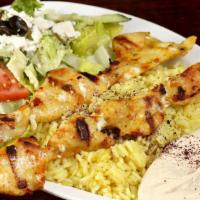 Kebab Plate (Regular) · Two charbroiled skewers served on a bed of seasoned rice, hummus and Greek salad. Tri-tip, k...