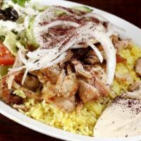 Shawarma Plate · Flame-broiled beef or chicken, seasoned rice, hummus and Greek salad.