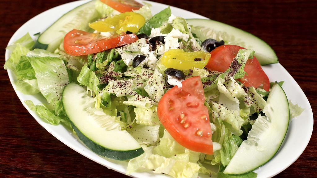 Greek Salad · Romaine lettuce, tomatoes, cucumbers, feta cheese, kalamata olives, pepperoncini, onions and cucumber mint dressing.
