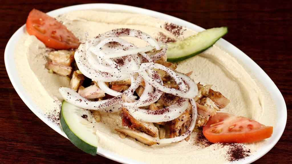 Shawarma Hummus Plate · Hummus topped with beef or chicken shawarma, 2 crispy falafel and pita bread.