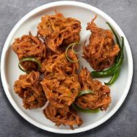 It Goes Onion Pakoda · Assorted vegetables dipped in a light batter and fried until golden brown made with chickpea...
