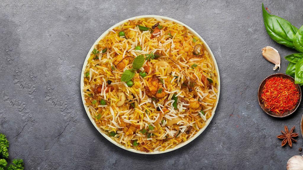 V For Veggie Biryani · Spiced seasoned vegetables cooked with Indian spices and basmati rice. Served with house raita.