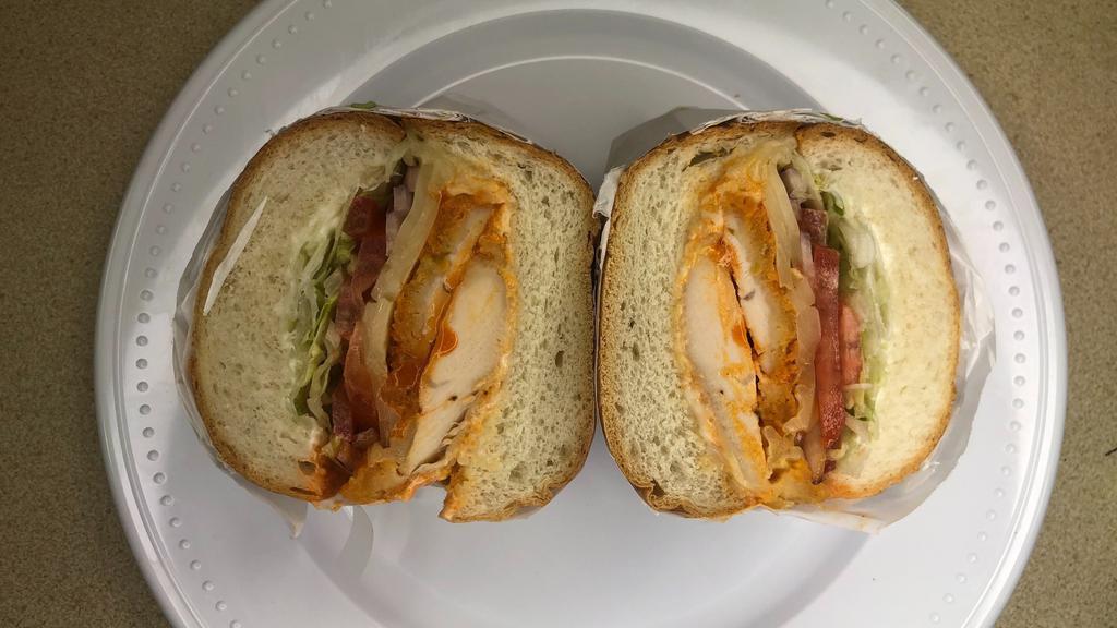 Blazin' Buffalo Sandwich · Breaded chicken topped with buffalo sauce, lettuce, tomato, onion, ranch, pepper Jack cheese, and mayonnaise toasted on a Dutch crunch roll.
