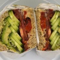 Vegan Veggie · Lettuce, tomato, onion, cucumber, roasted red bell peppers, avocado, and hummus toasted on a...