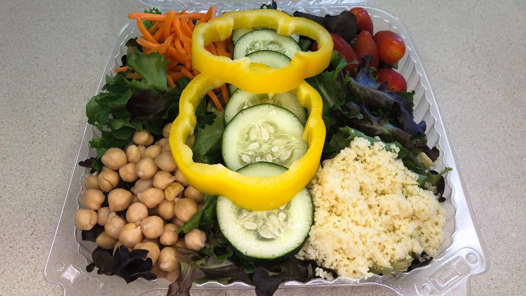 Garden Salad · Spring mix, tomato, cucumber, carrots, garbanzo beans, bell peppers & couscous. Add more items at an upcharge.