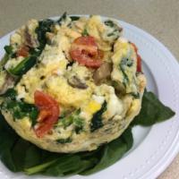 Veggie Frittata  · Crustless quiche; egg with spinach, tomato, mushrooms, & mozzarella cheese. These are made t...