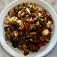 Fried Brussels Sprouts & Cauliflower · Lemon, capers, chiles, mint.