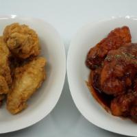 Chicken Wings (6) · Fried chicken wings. Choose spicy, soy glaze or no sauce.