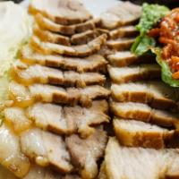 Bossam (Large) · Pork Belly Wraps: Braised pork belly, sliced and served with napa cabbage, spicy radish & ra...