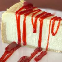 Cheesecake  · Slice of Cheesecake with Raspberry sauce (UD)