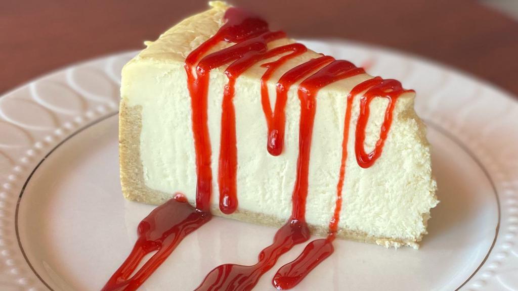 Cheesecake  · Slice of Cheesecake with Raspberry sauce (UD)
