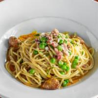 Spaghetti Carbonara  · pancetta, asiago, english peas, carrot, caramelized garlic
