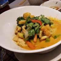 53. Yellow Curry · With mix potato, carrot and onions in a very mild yellow curry sauce.