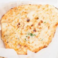 Naan · Leavened flour mixed with oil, milk and many more ingredients and baked in clay oven.