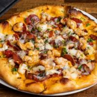 Shrimp & Chorizo Pizza · Saffron-piquillo pepper sauce, charred green onions, and toasted garlic, manchego.