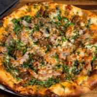 Guanciale Pizza · Cured pork cheek, Calabrian chili sauce, roasted cipollini onions, wild arugula, and Pecorino.