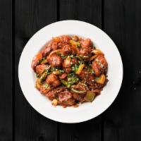 Cauli Manchurian · Crispy fried cauliflower florets are tossed in a spicy sauce with green onions and an Indo-C...
