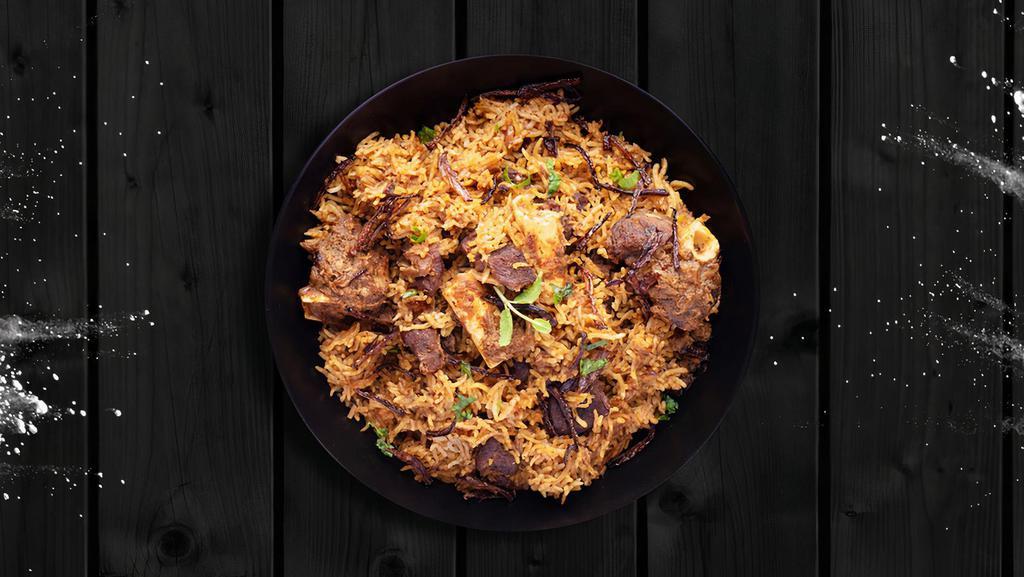 Mighty Mutton Biryani · Pieces of mutton marinated with herbs, Indian spices and cooked with long grain basmati rice and served with raita (special yogurt recipe with cucumbers and onions).