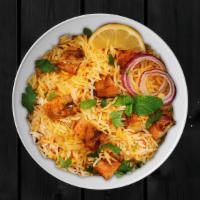 Boneless Chicken Biryani · Boneless chicken marinated with herbs, Indian spices and cooked with long grain basmati rice...