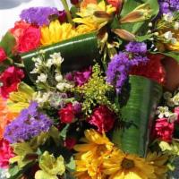 SK010. All About You · Yellow daisies, yellow alstroemeria, hot pink mini carnations, pink stock, purple statice, w...