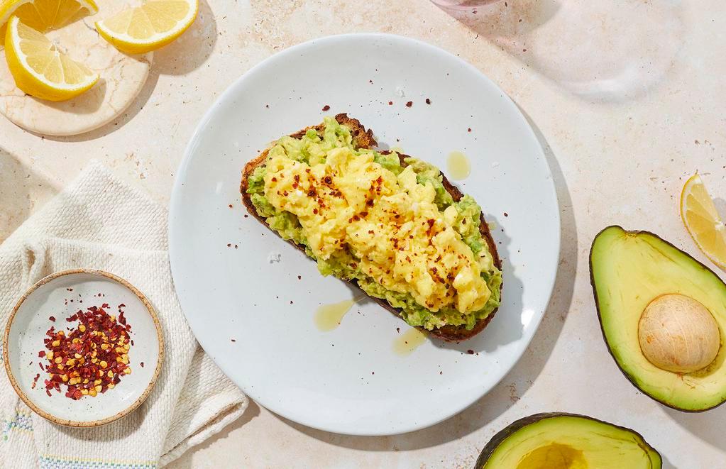 Avocado Toast Scramble · Avocado toast with scrambled eggs and chili flakes.