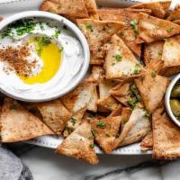 Vegan Pita Chips (VPC) · Artisan Baguette slices covered in premium garlic butter. This item contains dairy.