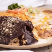 25. Chicken Mole · Chicken, rich dark chocolate sauce made with ground chilies, seeds, nuts, spices, cheese, co...