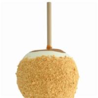 Cheesecake Apple · Caramel-covered Granny Smith apple dipped in white confection, rolled in crushed graham crac...