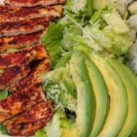 Spicy Chicken Salad · Romaine lettuce topped with a broiled spicy chicken breast, avocado, parmesan cheese with ou...