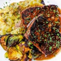 Blackened Meatloaf · seared with Creole spices and served with red eye gravy, mashed potatoes and seasonal roaste...