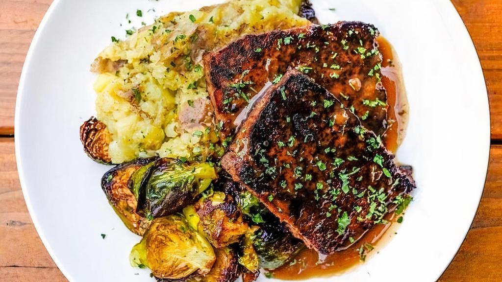 Blackened Meatloaf · seared with Creole spices and served with red eye gravy, mashed potatoes and seasonal roasted veggies.