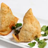 Vegetable Samosa (2 Pcs.) · Vegetarian. Crisp turnovers stuffed with mildly spiced potatoes and peas fried in vegetable ...