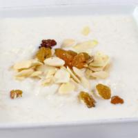 Rice Pudding (Kheer) · Traditional Indian rice pudding with nuts flavored with cardamom and rose water.