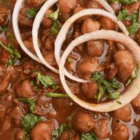 Amritsari Chole · Chick peas cooked in a rich gravy of onions and tomatoes tempered with Amritsari spices.