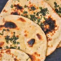 Kulcha · A popular soft leavened North Indian flatbread with cilantro & onions