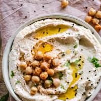 Hummus · A smooth thick mixture of mashed chickpeas, tahini, oil, lemon juice, and garlic. Homemade! ...
