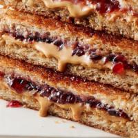 Peanut Butter and Jelly · Organic bread toasted and served with organic jam and organic peanut butter.
