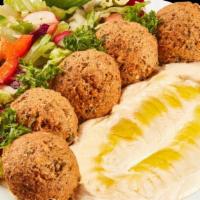 Falafel Plate · 4 pieces of fresh-made falafel served with tahini sauce, onions, side salad, hummus, and pit...